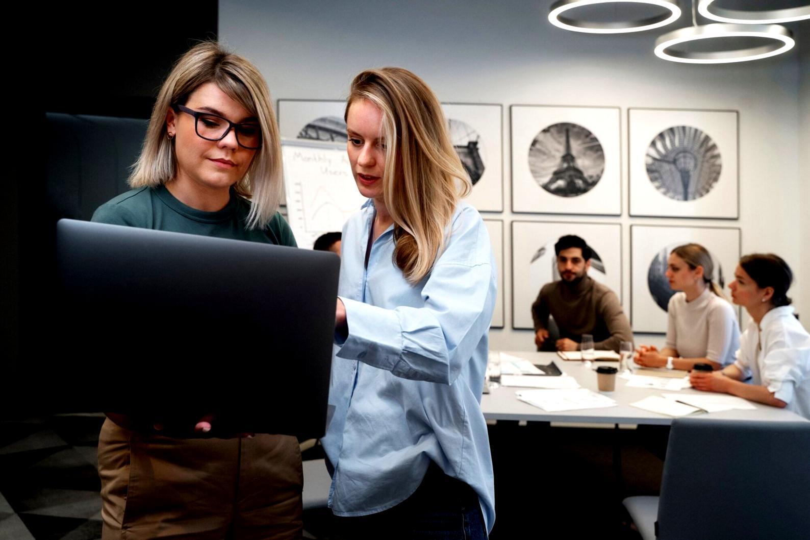 Professional event planning workspace with detailed budget documents and planning materials